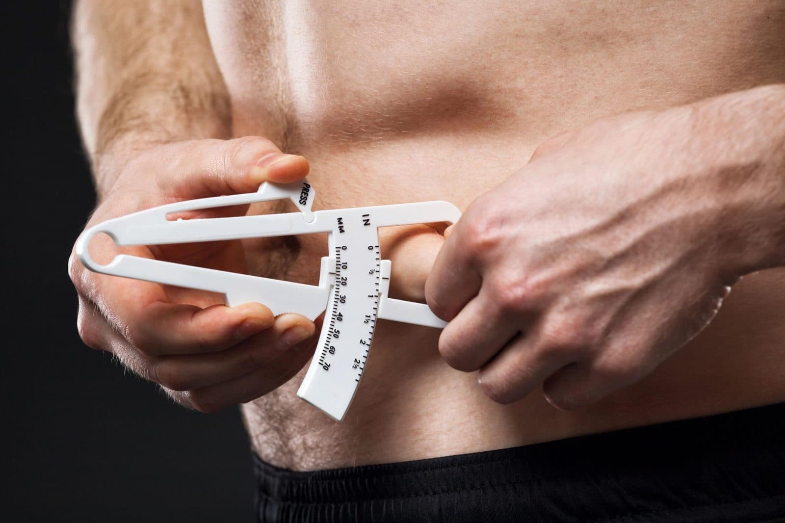 Skinfold callipers measuring body fat